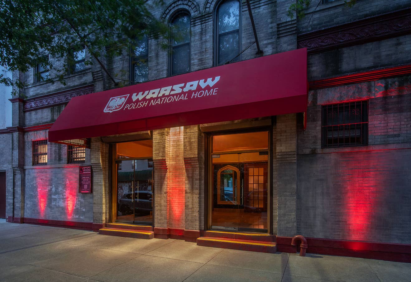 a photo of Warsaw's main entrance which features a red awning that says Warsaw Polish National Home above the double doors